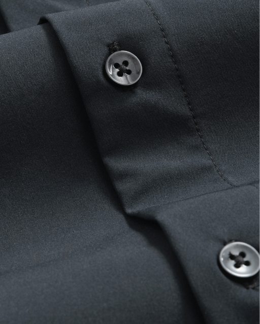 Black dress shirt fabric close up, black buttons