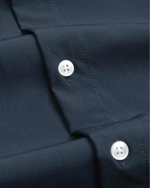 Close up of fabric of navy dress shirt