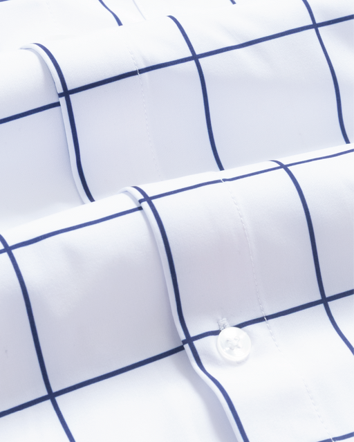 Close up of a white shirt with navy windowpane