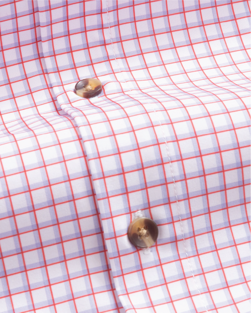 close up of white shirt with red and purple windowpane. Tortoise shell buttons.