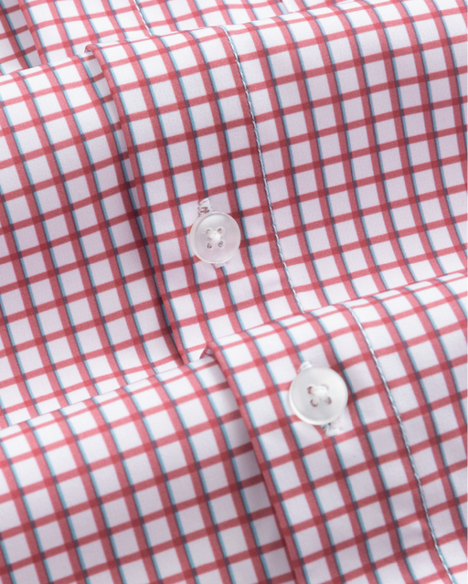 Closeup of a red and white checkered shirt with blue accent