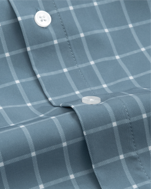 Close up of ocean blue with white windowpane shirt