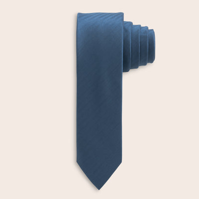 Blue tie on a light beige background