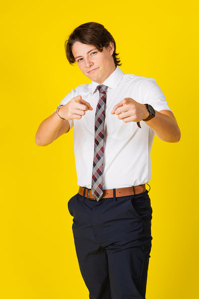 Plaid tie with red, blue, and gray pattern on a white shirt