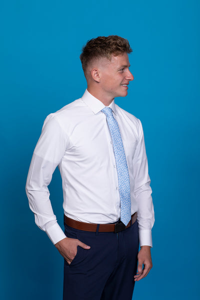 Blue floral patterned tie on a white shirt