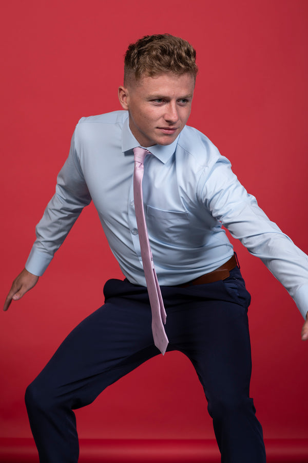 Pink tie with light grey cactus on a blue shirt.