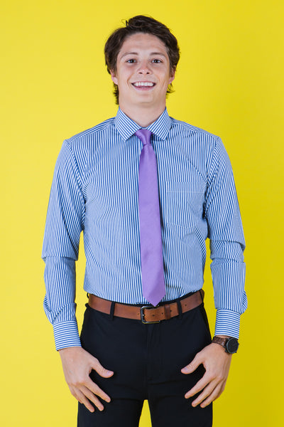 Purple striped tie on a blue shirt